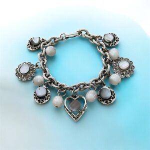 Mother of Pearl and faux pearl vintage charm bracelet. See listing.
